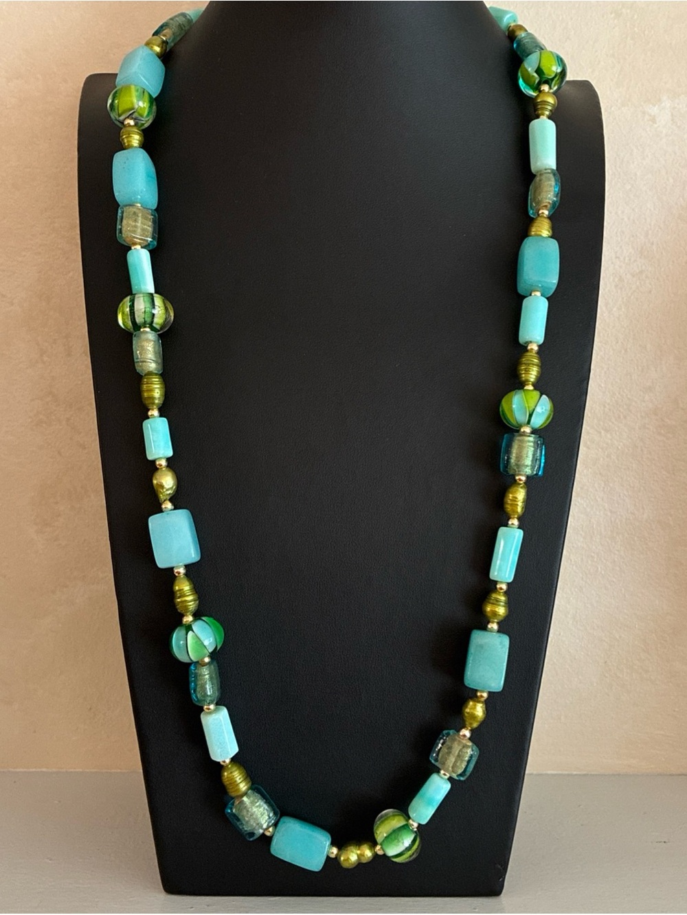 Hand crafted necklace with stone, pearl, and art glass beads in aqua and green